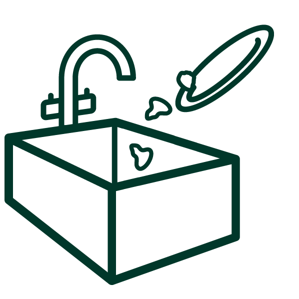 Scraping food waste into the sink